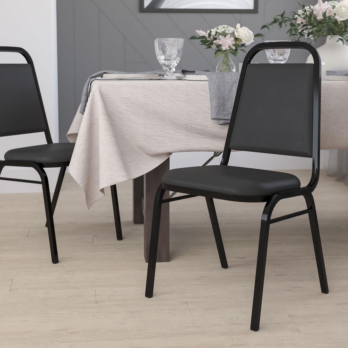 Flash Furniture Trapezoidal Back Stacking Banquet Chair in Black Vinyl with 1.5" Thick Seat
